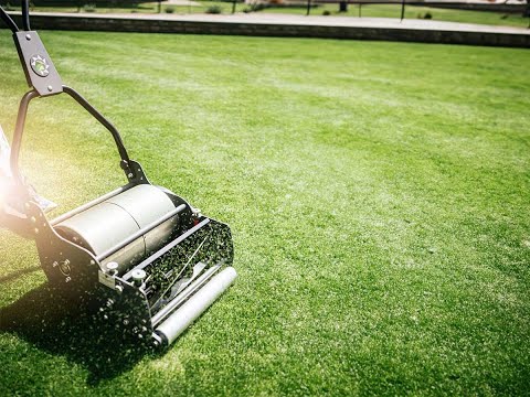 professional reel mower cutting grass close to ground